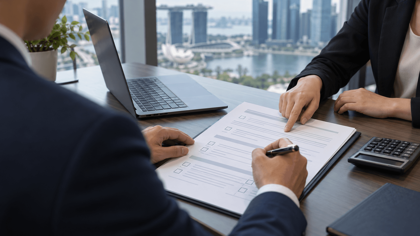 A business owner reviewing a printed cyber insurance proposal form with a broker pointing at a clause
